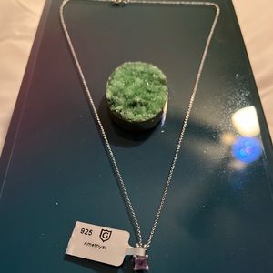 Brand new sterling silver necklace with Amethyst pendant.